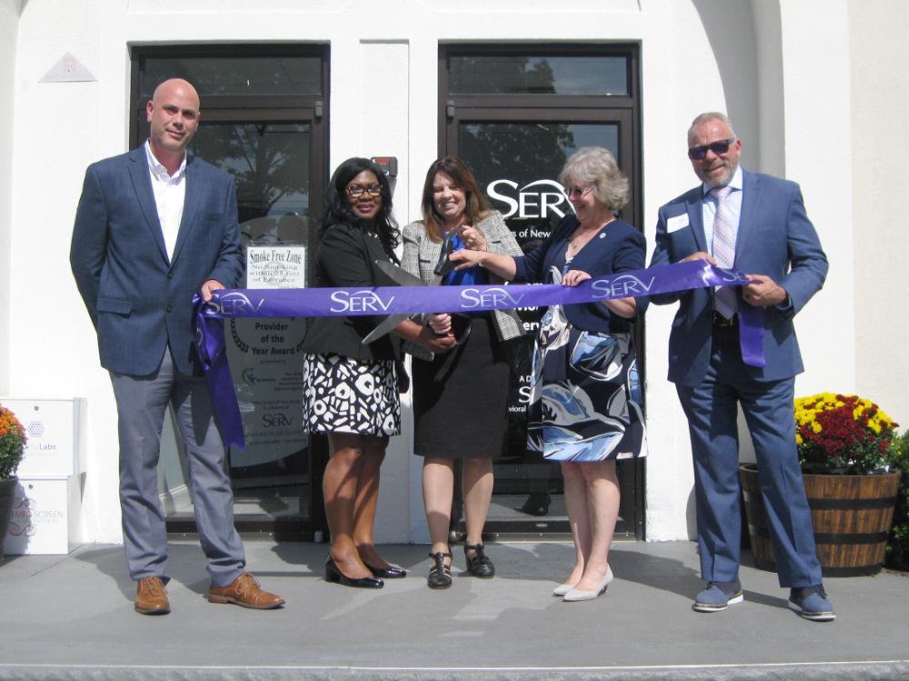 Celebrating the grand opening and ribbon cutting of SERV Centers of N.J.’s CCBHC program in Clifton are, from left, Matt Mantone, VP Program Development; Pauline Simms, COO of SERV Centers; Regina Widdows, SERV Behavioral Health System President/CEO; Deb Hartel, Deputy Commissioner for Integrated Health Services for the N.J. Department of Health; and Marc Ackerman, Director of the CCBHC/Outpatient program.