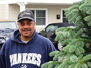 Greg stands outside a group home in Middlesex County, where he is working on painting the dining room. He is the first SERV consumer to be hired as a permanent part-time employee with SERV’s maintenance department.