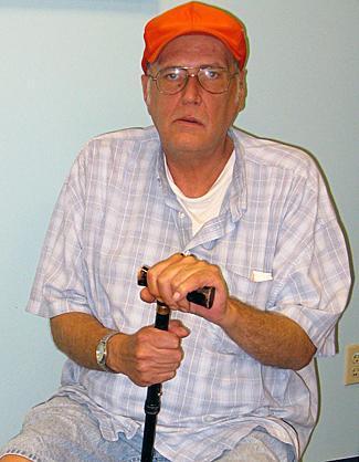 Ronald Pitak sits in a room he painted at SERV Centers Passaic County where he is a consumer and a part-time maintenance worker. He also is the inventor of The Pitak helmet for firefighters, miners and rescue workers.